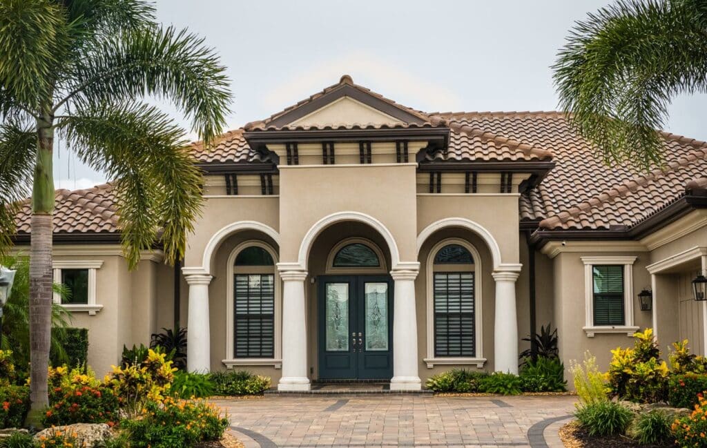 Painters for house with lush landscaping.